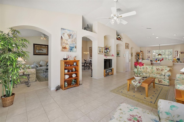 living room with ceiling fan, light tile patterned floors, and high vaulted ceiling