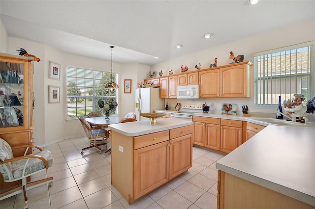 kitchen with light brown cabinets, white appliances, hanging light fixtures, light tile patterned floors, and a kitchen island