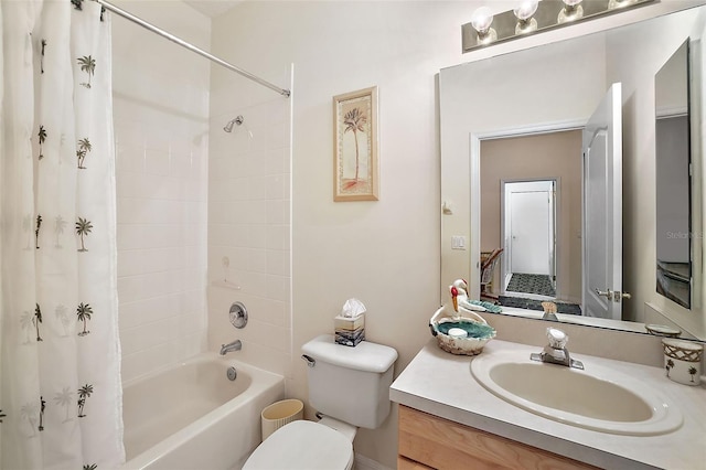 full bathroom featuring vanity, shower / bath combination with curtain, and toilet