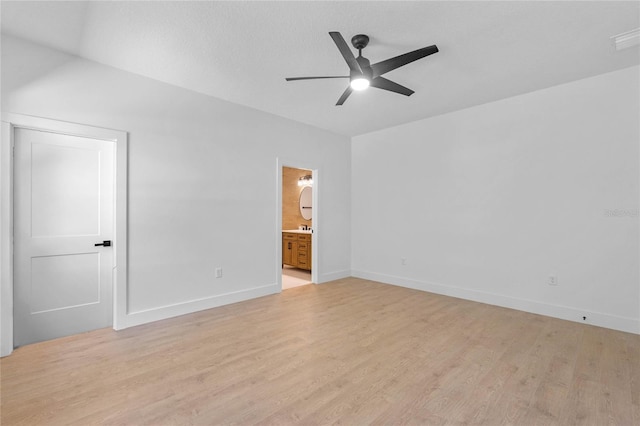 unfurnished bedroom featuring ceiling fan, connected bathroom, and light hardwood / wood-style floors