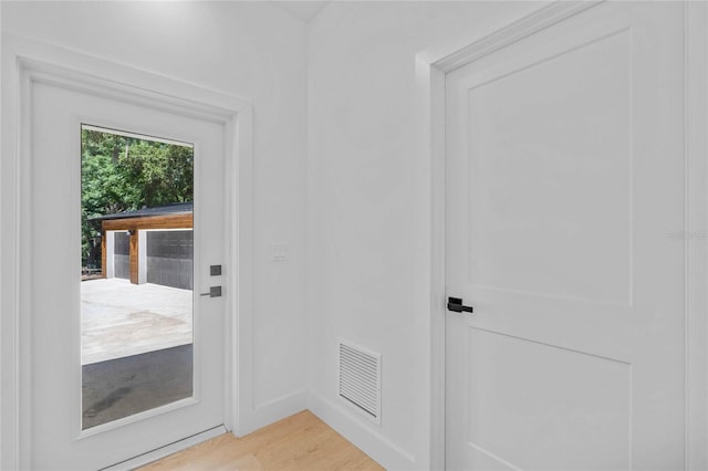 doorway featuring light hardwood / wood-style floors