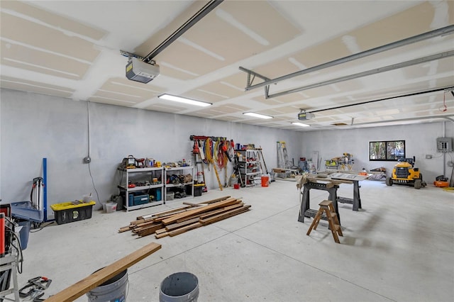 garage featuring a workshop area and a garage door opener