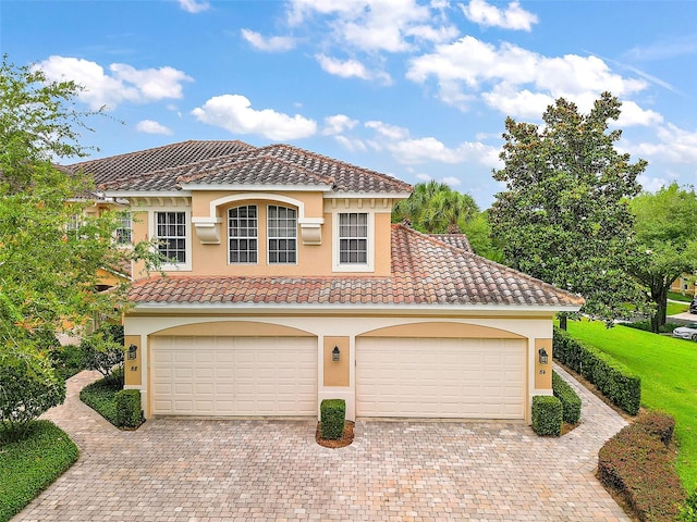 mediterranean / spanish-style house featuring a garage