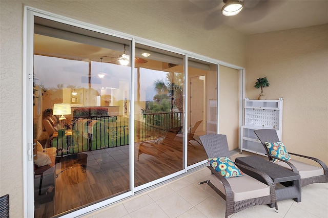 entryway with ceiling fan and tile patterned floors