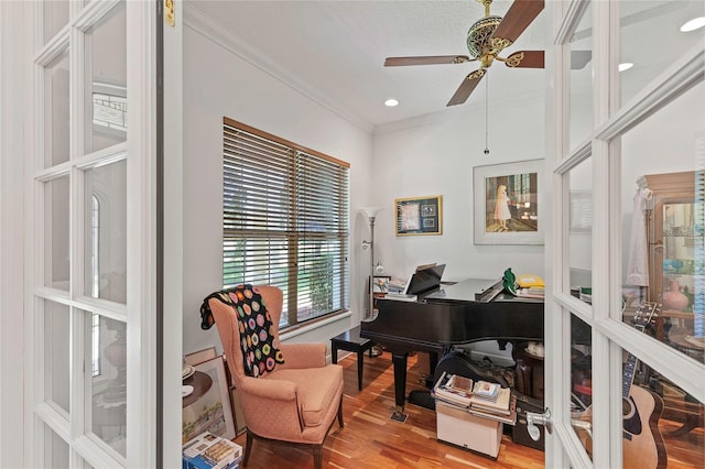 office space with ceiling fan, hardwood / wood-style flooring, ornamental molding, and french doors