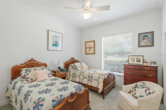 bedroom with a textured ceiling, ceiling fan, ornamental molding, and light colored carpet