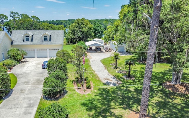 view of front facade with a garage and a front lawn