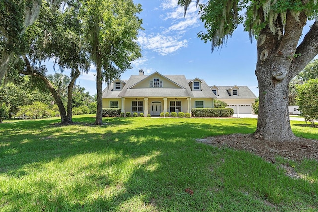 view of front of house featuring a front yard and a garage