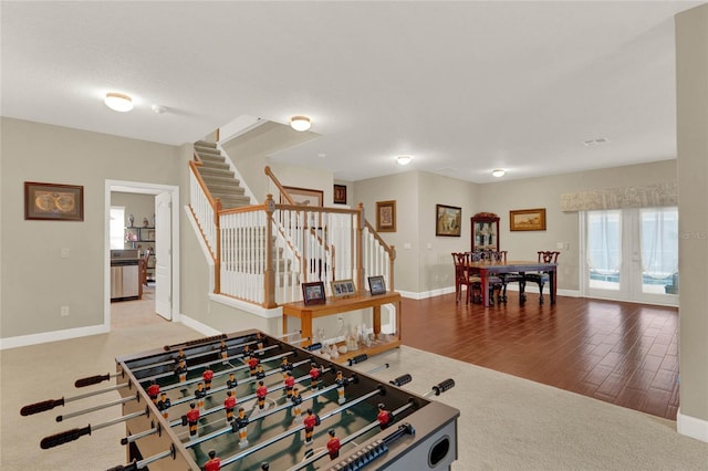 game room featuring wood-type flooring and french doors