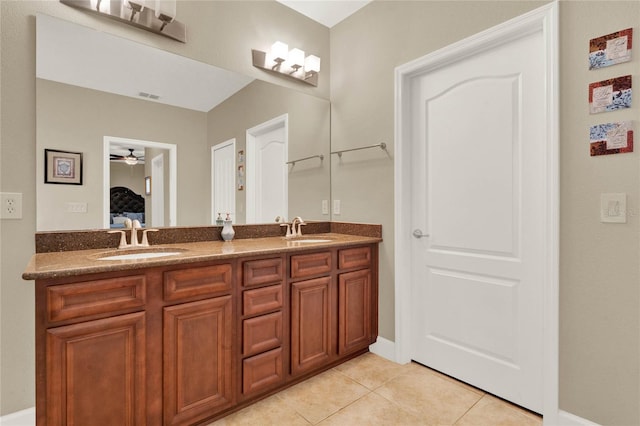 bathroom with ceiling fan, vanity, and tile patterned flooring