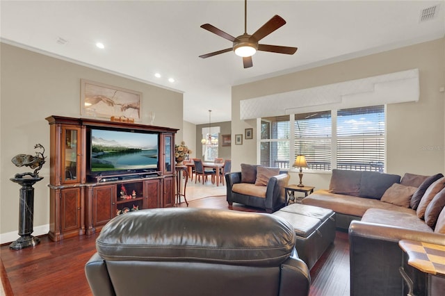 living room with ceiling fan, dark wood-type flooring, and crown molding