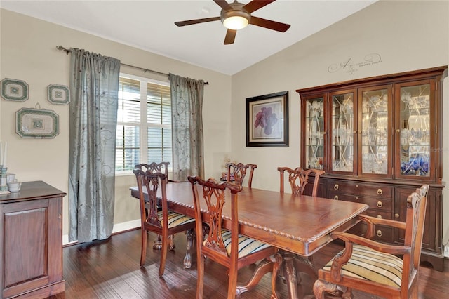 dining area featuring ceiling fan, dark hardwood / wood-style flooring, and lofted ceiling