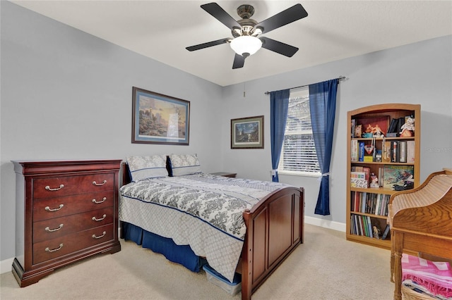 bedroom featuring ceiling fan and light colored carpet