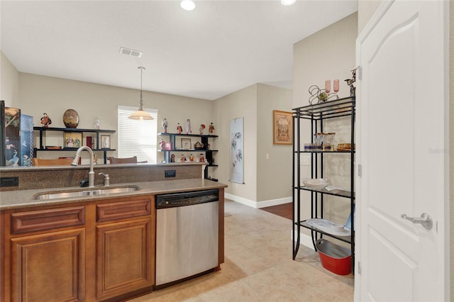 kitchen featuring sink, pendant lighting, and stainless steel dishwasher