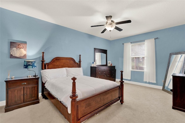 bedroom with ceiling fan and light colored carpet