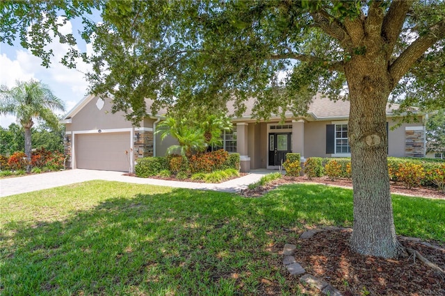 ranch-style home featuring a front yard and a garage