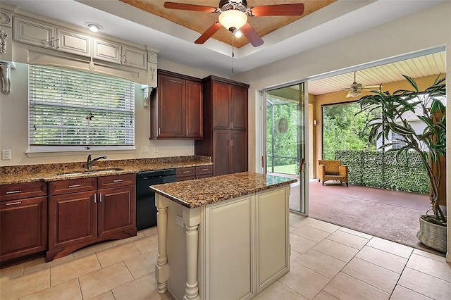 kitchen with light carpet, light stone counters, a center island, sink, and black dishwasher