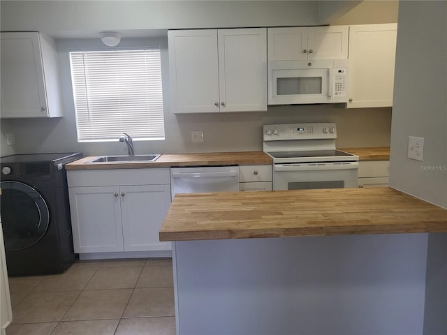 kitchen with washer / dryer, white cabinets, butcher block countertops, sink, and white appliances