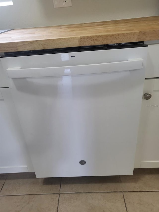 interior details featuring white dishwasher and tile flooring