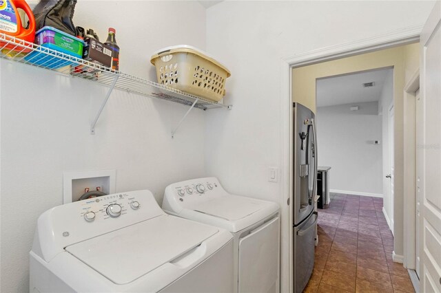 washroom with separate washer and dryer