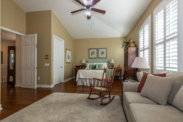 interior space with lofted ceiling, ceiling fan, and dark hardwood / wood-style floors