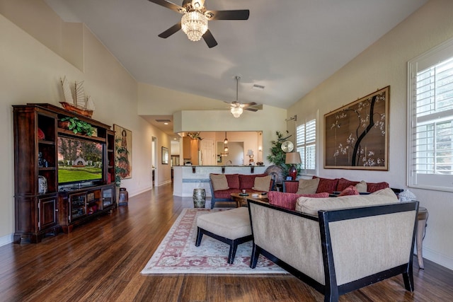 living room featuring a wealth of natural light, dark hardwood / wood-style floors, ceiling fan, and lofted ceiling