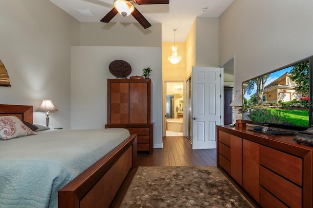 bedroom with dark hardwood / wood-style flooring, ensuite bathroom, and ceiling fan