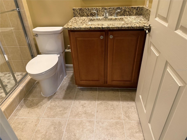 bathroom featuring walk in shower, tile patterned floors, vanity, and toilet