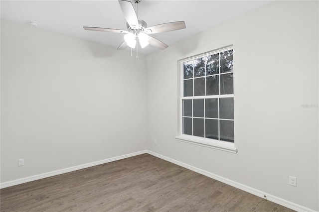 empty room with hardwood / wood-style flooring and ceiling fan