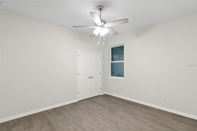 empty room featuring hardwood / wood-style floors and ceiling fan