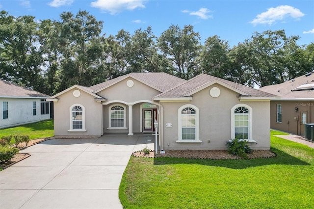 ranch-style home with central AC and a front yard