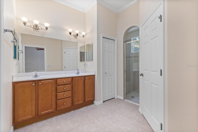 bathroom featuring crown molding, an enclosed shower, and vanity