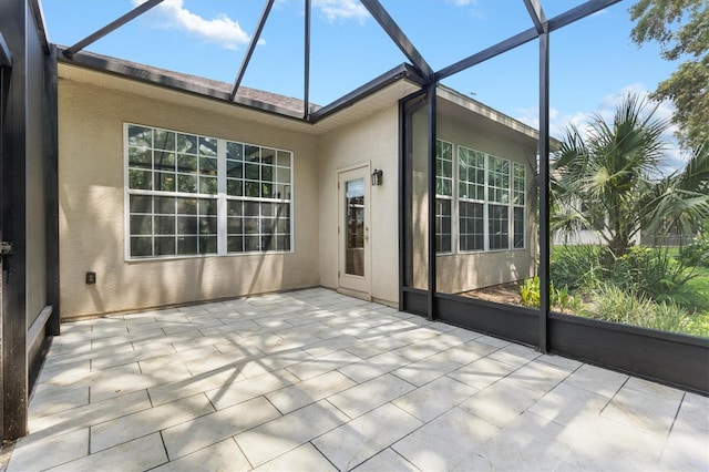 unfurnished sunroom featuring a wealth of natural light