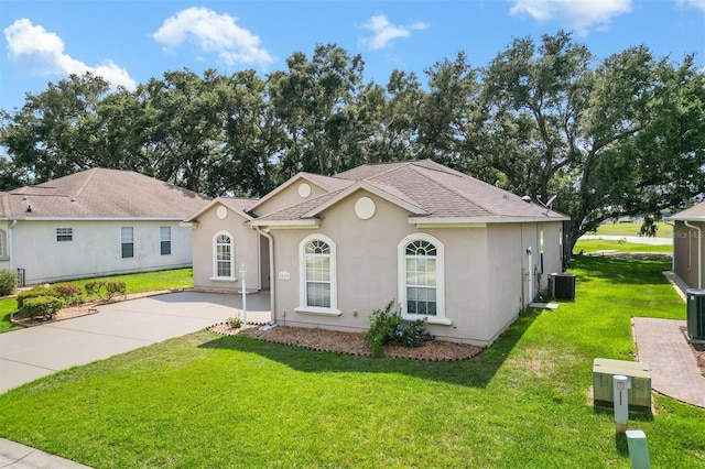 view of front of house featuring central AC unit and a front lawn