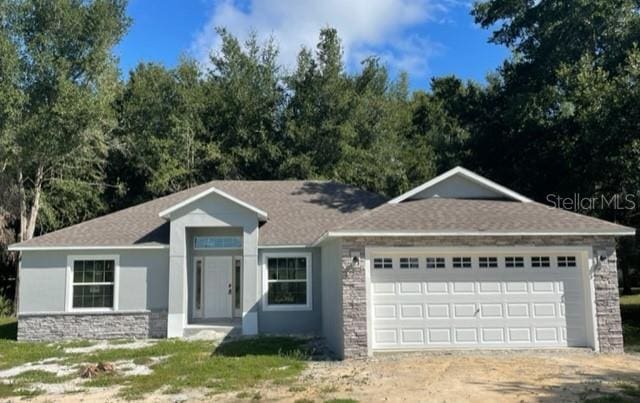 view of front of property with a garage