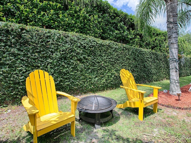 view of yard with an outdoor fire pit