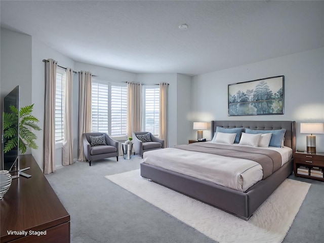 bedroom with light colored carpet