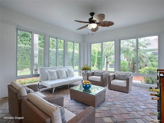 sunroom / solarium with ceiling fan