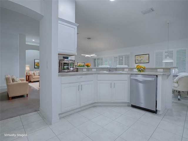 kitchen featuring decorative light fixtures, stainless steel dishwasher, white cabinetry, and light tile patterned flooring