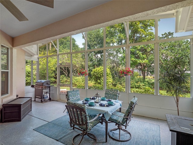 sunroom / solarium featuring ceiling fan