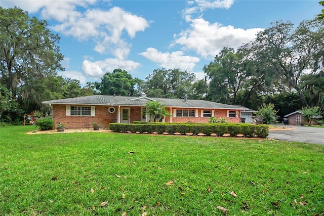 ranch-style house with a front lawn