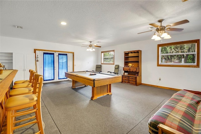 rec room with carpet flooring, ceiling fan, a textured ceiling, and billiards