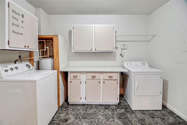 laundry area featuring cabinets, independent washer and dryer, and water heater