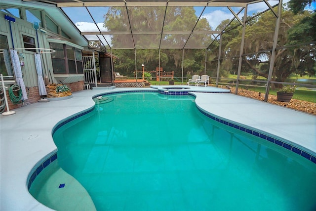 view of pool with a lanai and a patio