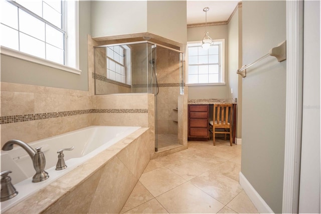 bathroom featuring tile patterned floors and separate shower and tub