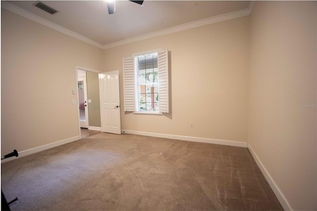 carpeted empty room with ceiling fan and ornamental molding