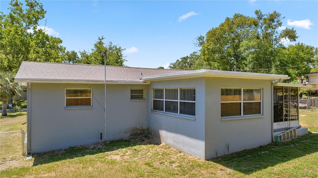 view of side of property with a lawn