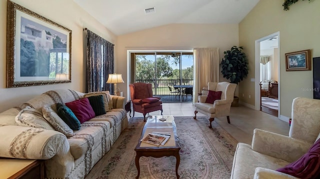 tiled living room featuring lofted ceiling