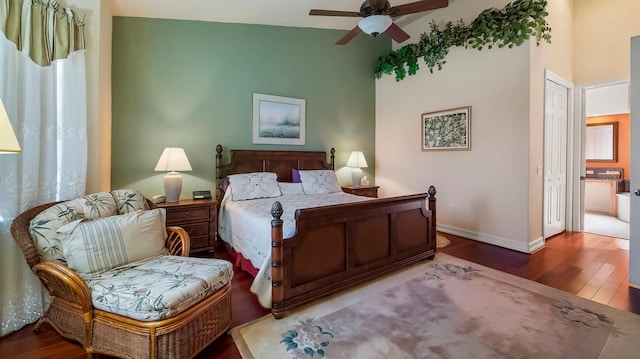 bedroom with a closet, hardwood / wood-style flooring, and ceiling fan