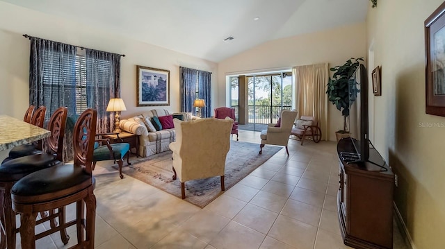 tiled living room with lofted ceiling